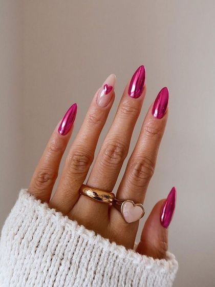 Make a statement this Valentine's Day with these hot pink chrome nails, complete with a sheer accent nail and a delicate heart.
