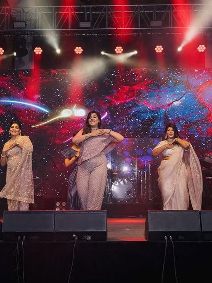A wide shot of the welcome dance, showing the beautiful stage setup and synchronized moves.