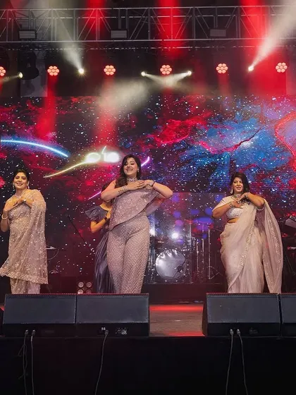A wide shot of the welcome dance, showing the beautiful stage setup and synchronized moves.