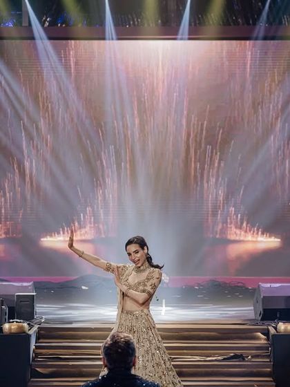 A stunning solo moment for the bride, complete with stage effects. I work to create these picture-perfect moments that capture the grandeur of the performance.