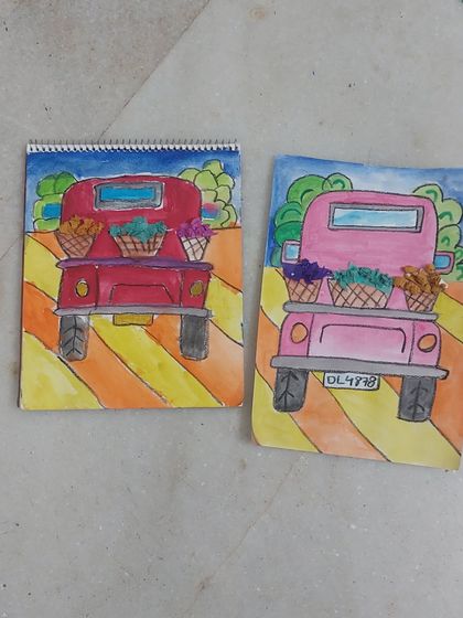 A pair of charming truck paintings, each with its own unique color palette. This was a fun session where students learned about color blending and composition.
