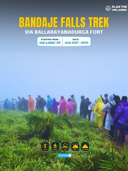 A colorful line of trekkers in raincoats on the misty trail of the Bandaje Falls trek.
