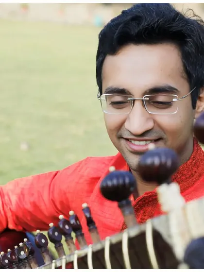 A creative shot over the pegs of the sitar, offering a unique perspective.