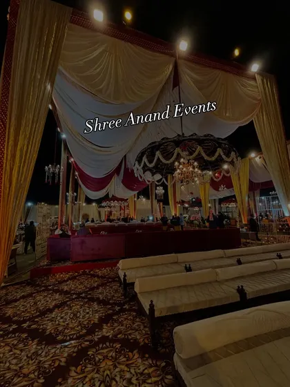 A wide shot of the main seating area, with a large, ornate umbrella and chandelier combination as the central design element.