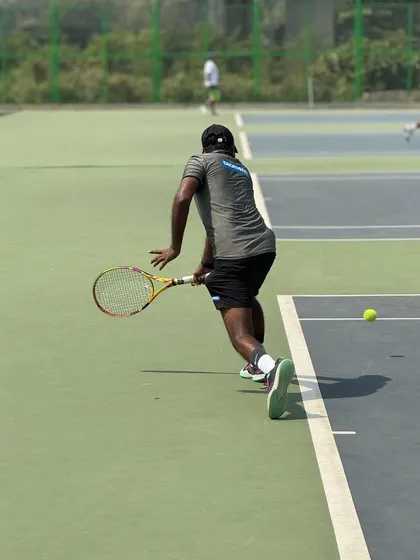 Hitting a backhand during a match at the Kalina tournament. Staying match-fit is a top priority.