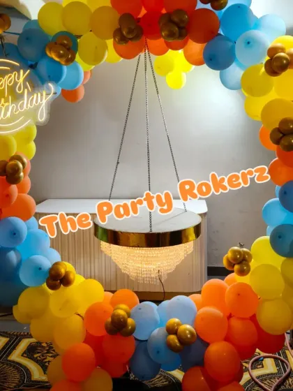 Another view of the balloon ring with the hanging cake table, showing how it can be customized with different balloon colors to match any party theme.