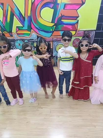 Ready to perform! The kids are backstage in their "Kala Chashma" sunglasses, feeling cool and confident before their big moment.