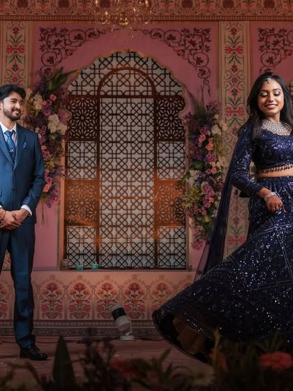 A dynamic shot of Dr. Akshara twirling in her lehenga. The movement shows off the flow of her outfit and the elegance of her overall look.