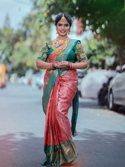 A real bride looking elegant and poised. I used soft, natural tones to complement her peach and green Kanjeevaram saree, ensuring she looked comfortable and beautiful.