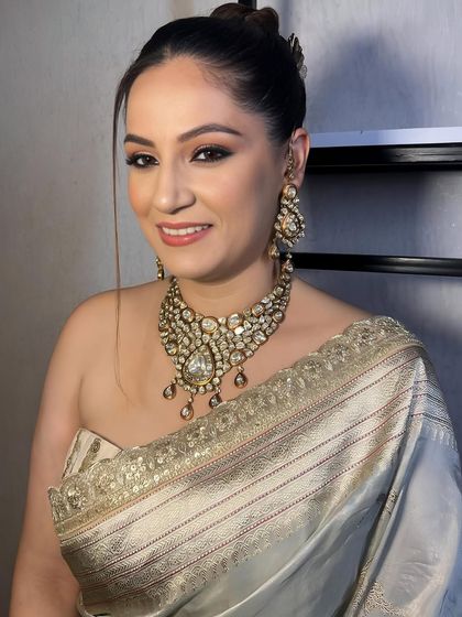 Grace in every drape. A client looking timelessly beautiful in a saree with soft, elegant makeup.