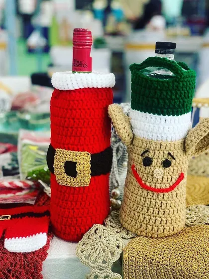 Another shot of the popular Santa and reindeer wine bottle covers.