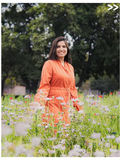 A simple, joyful portrait session in one of Delhi's beautiful gardens. My focus here was on using the natural light and vibrant colors of the flowers to complement her bright personality, creating a relaxed and authentic lifestyle photo.