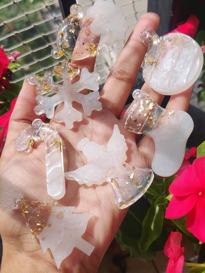 A handful of beautiful, translucent resin Christmas ornaments, perfect for adding a handmade touch to your holiday decor.