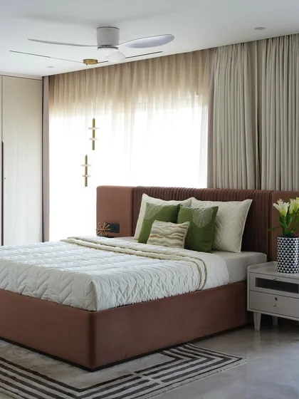 The parent's bedroom in the Evelyn project is all about comfort and understated charm. The room is filled with natural light, and the calm ambiance is layered with prints and textures to make it feel like a warm retreat.