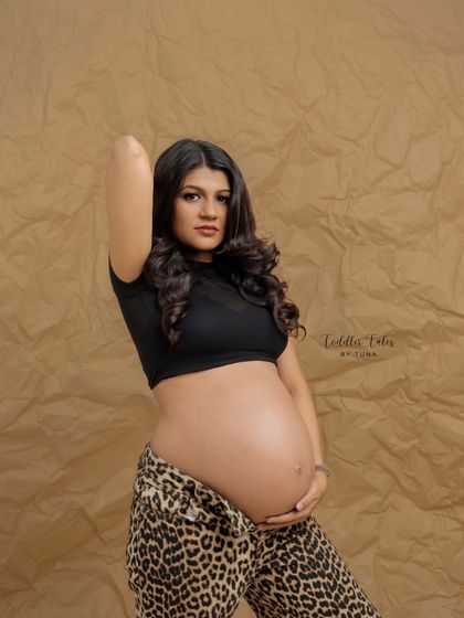 A direct, confident gaze. This portrait captures the fearless spirit of modern motherhood. The styling is edgy, cool, and completely unique.