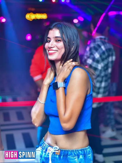 A guest enjoying the music at Drava's Lipstick Ladies Night. The vibe is always fun and energetic.