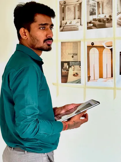 Reviewing 3D renders with the physical space. I tape printouts of the designs to the wall to help clients visualize the final outcome.