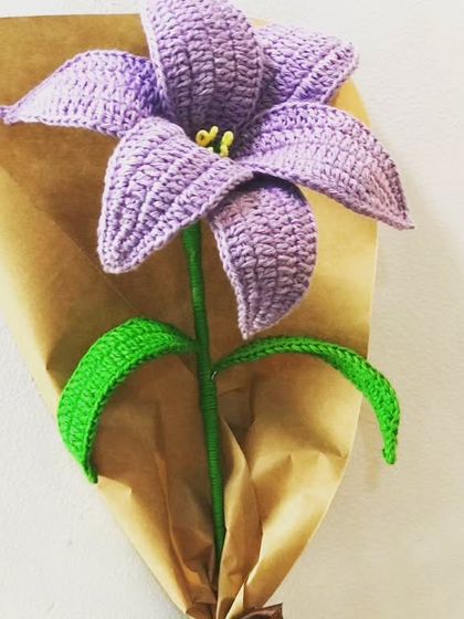 I love working with different colors, and this purple lily is a great example. The rich color and detailed stitching make it a striking piece that stands out in any bouquet or as a single stem.