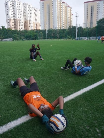 Players take a well-deserved rest after an intense session at the U16 & U18 trials. Stamina and fitness are critical.