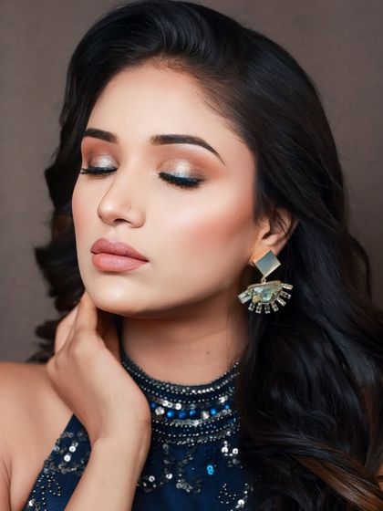 A close-up of the glamorous party look, with the model's eyes closed to show off the beautiful eyeshadow.