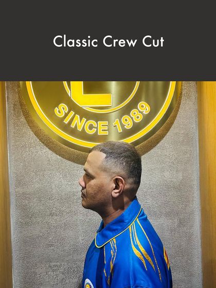 You can't go wrong with a Classic Crew Cut. This timeless style is expertly executed with a clean fade, offering a low-maintenance yet sharp look that is always in fashion.