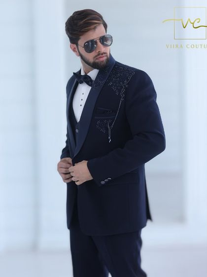 Another angle of the stylish navy tuxedo, perfect for making a statement.