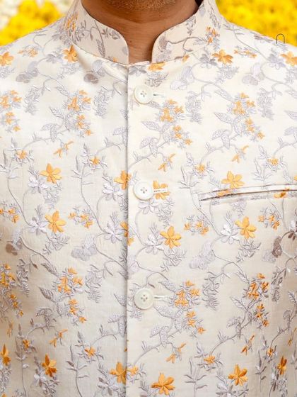 For the Haldi ceremony, we created this stylish sleeveless jacket with floral embroidery. It's a light and festive layer, perfect for the joyous and colorful celebration.