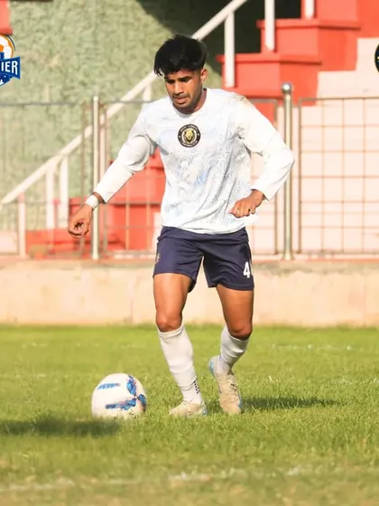 A player on the ball, looking composed and in control of the situation.