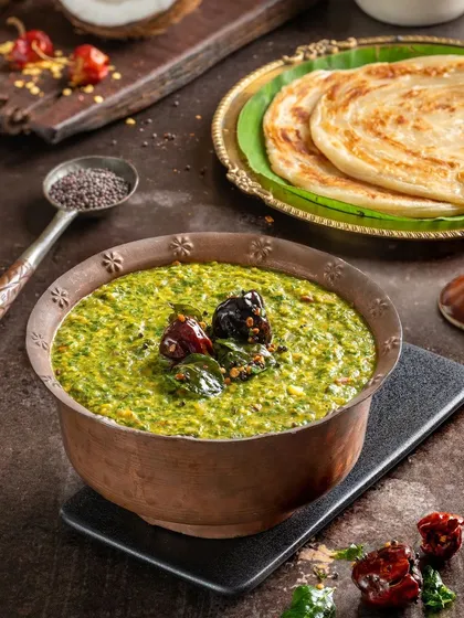Keerai Kootu, a healthy and delicious spinach and lentil curry. The rustic bowl and fresh ingredients highlight its wholesome nature.