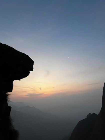 The silhouette of the mountains at dawn, just before the sun appears. A truly mesmerizing view from Kolukkumalai.