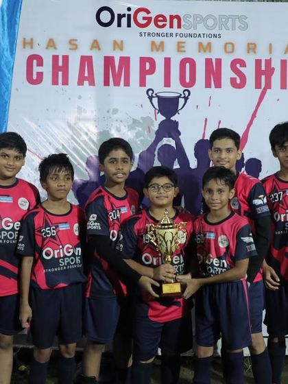 Our Under 13 team proudly holding their trophy at the championship.