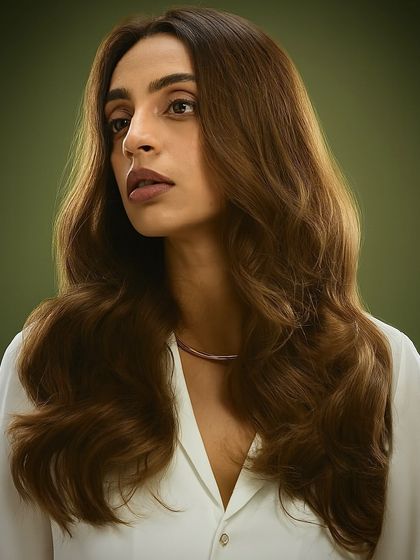 A soft, wavy style from our Bespoke Brunette campaign. This look showcases a natural-looking brown with subtle lighter pieces to frame the face and add movement.