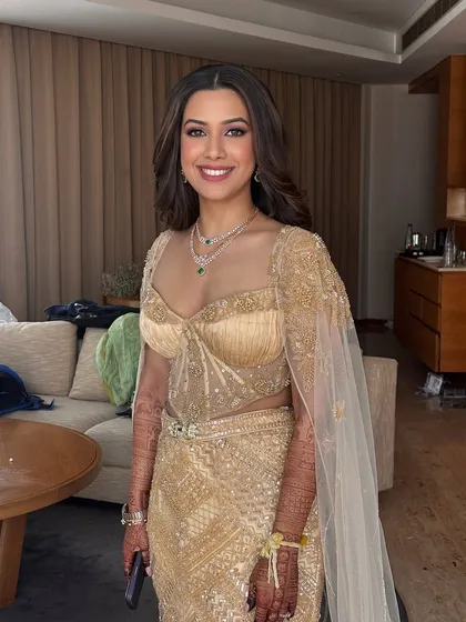The bride's smile says it all. This look is about enhancing her natural beauty to make her feel confident and stunning for her reception.