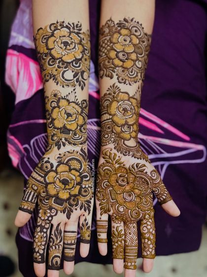 A beautiful floral design for an engagement bride. The patterns are a mix of large, bold flowers and smaller, delicate buds.