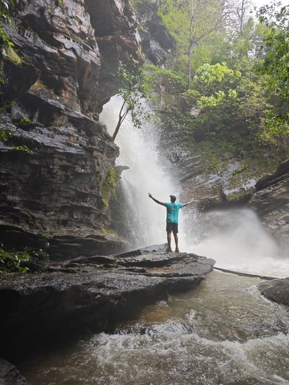 A moment of pure freedom in front of a hidden waterfall in the Sharavathi Valley. We guide you to these secluded spots for an unforgettable experience.