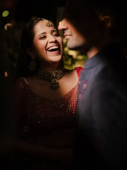 Pure, unadulterated joy. This candid photo captures the fun of the event, and the bride's makeup looks flawless even in motion.