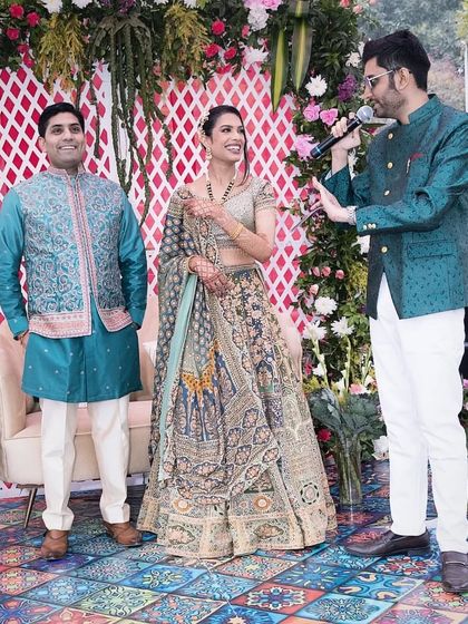 A candid interaction with the couple, sharing a light moment during their Mehendi ceremony.