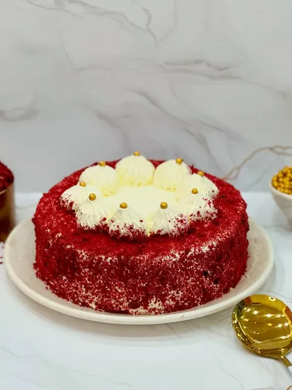 Dive into the cheesy and spongy taste of my Red Velvet cake. This professionally shot image shows the perfect slice, revealing the moist layers and creamy frosting that make this cake a bestseller.