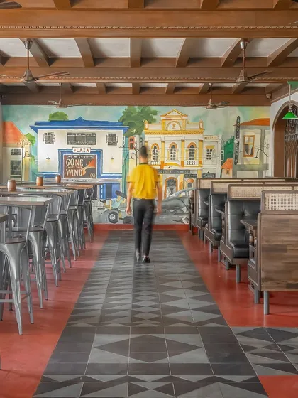 A throwback to old Bangalore. This mural inside a pub depicts a classic city street scene, complete with vintage architecture. It showcases our ability to create nostalgic pieces that transport customers to another era.