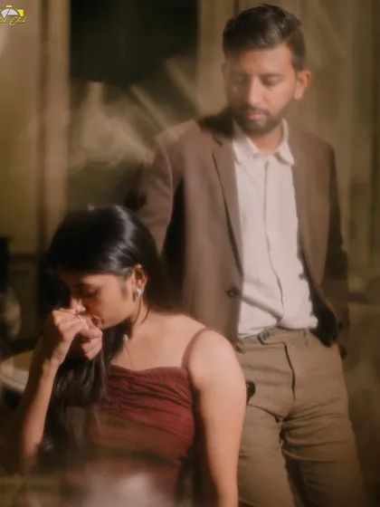 An artistic, moody shot with motion blur, capturing a quiet, contemplative moment between the couple in Pondicherry.
