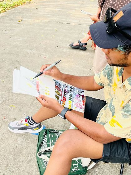 A candid shot of me sketching at the temple in Nagpur. I'm completely absorbed in the process.