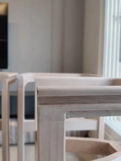A close-up of the joinery on the custom dining chairs. This level of craftsmanship is what defines our work.