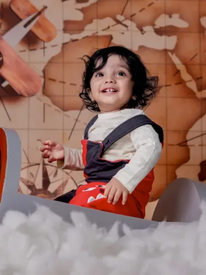 The sweetest little one to brighten our world, ready for an adventure in his airplane.