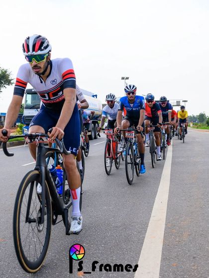 An elite rider, leading the peloton in a long and grueling race.