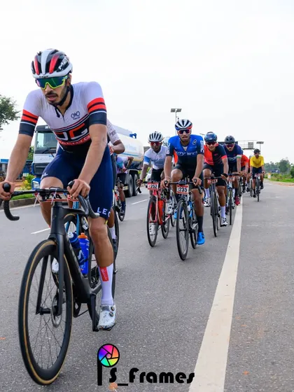 An elite rider, leading the peloton in a long and grueling race.