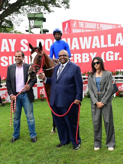 Inspire, winner of The Turf Authorities of India Trophy, poses with jockey S. Antony Raj and the owners.