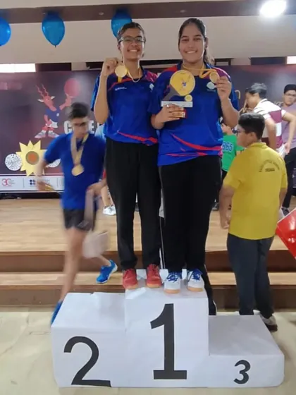 Ayushi and Samriddhi on the top step of the podium, celebrating their U-19 Girls Individual and Team Gold medals.