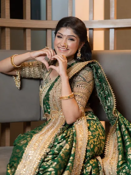 Royal elegance in a traditional green and gold Nauvari saree. I focused on soft contouring, glowing skin, and subtly defined eyes to create a look of classic Marathi finesse.