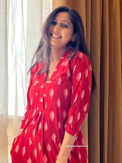 A close-up of my bestselling red Ikat dress-cum-kurta. You can see the beautiful texture of the handloom fabric and the practical pockets.