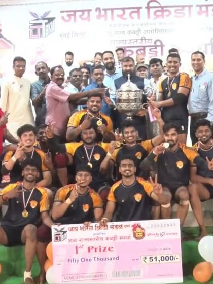 Another angle of our team with the championship trophy, a testament to our collective effort and training.